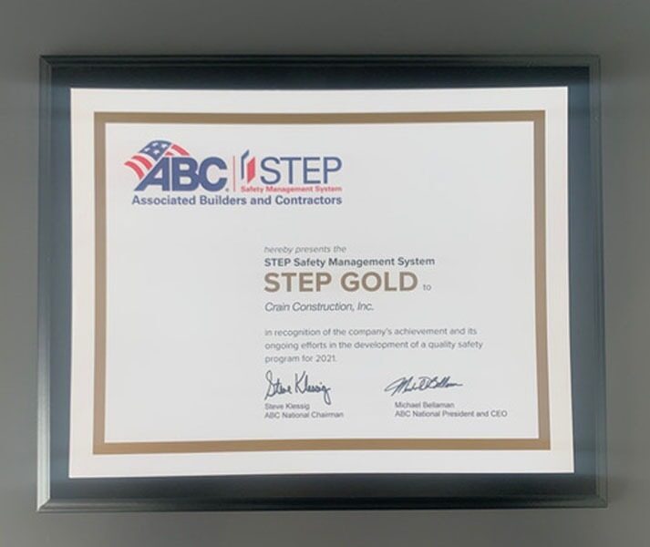 Crain construction's gold safety award certificate framed