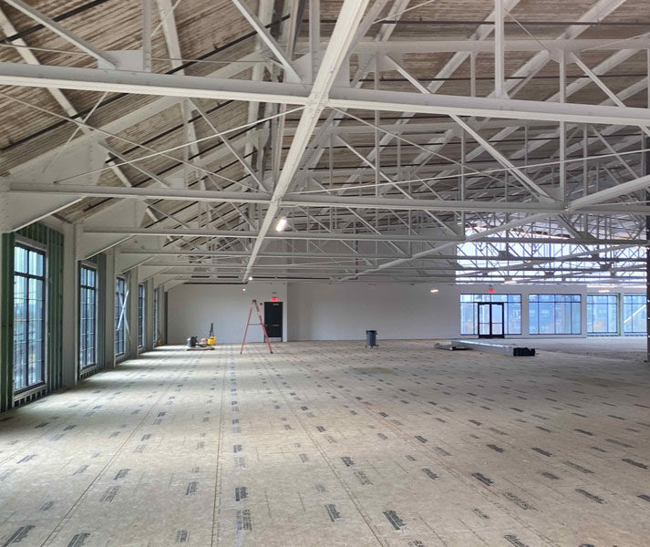 Specialty Dental Brands Headquarters under construction with exposed beams and unfinished floors.