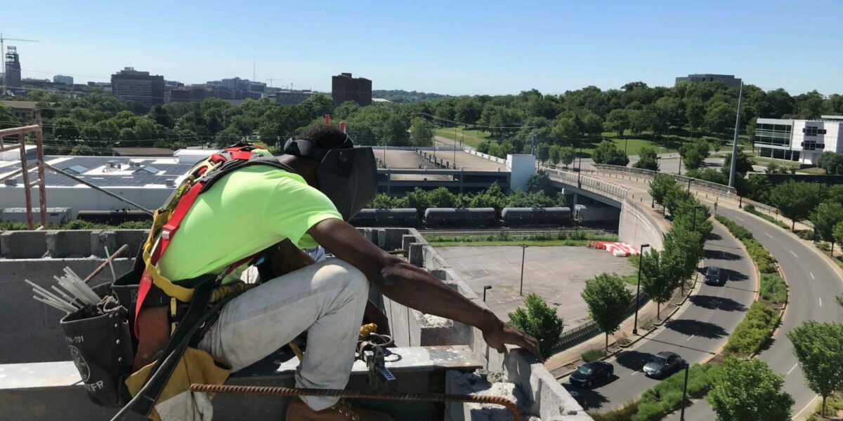Crain construction worker on scaffolding at the element hotel job site