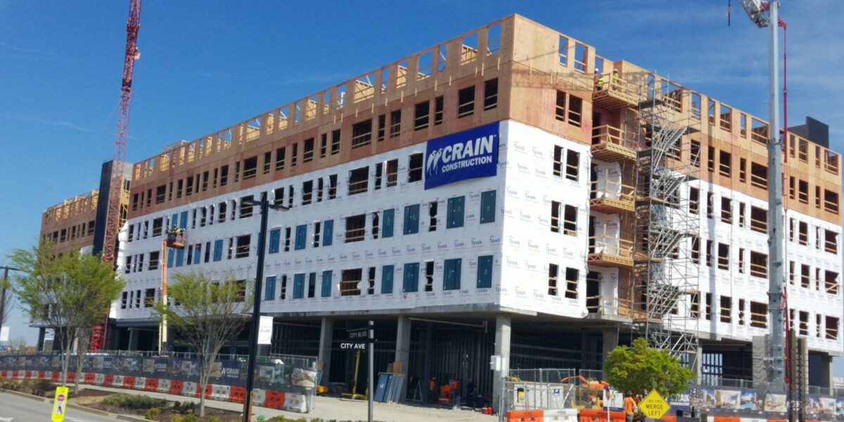 Element Onecity building under construction with crains out front.