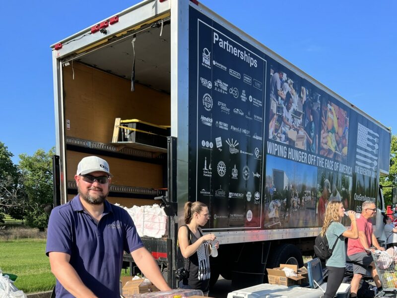 One Generation Away smiling volunteer