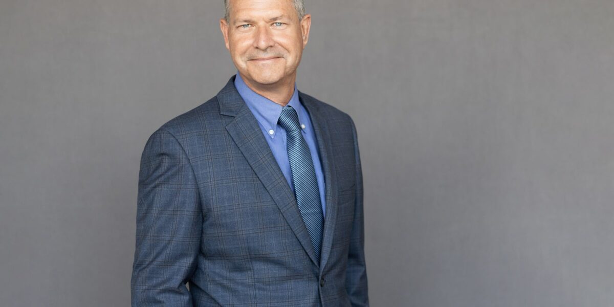 A professional portrait of Mike Gribble, VP at Crain Construction