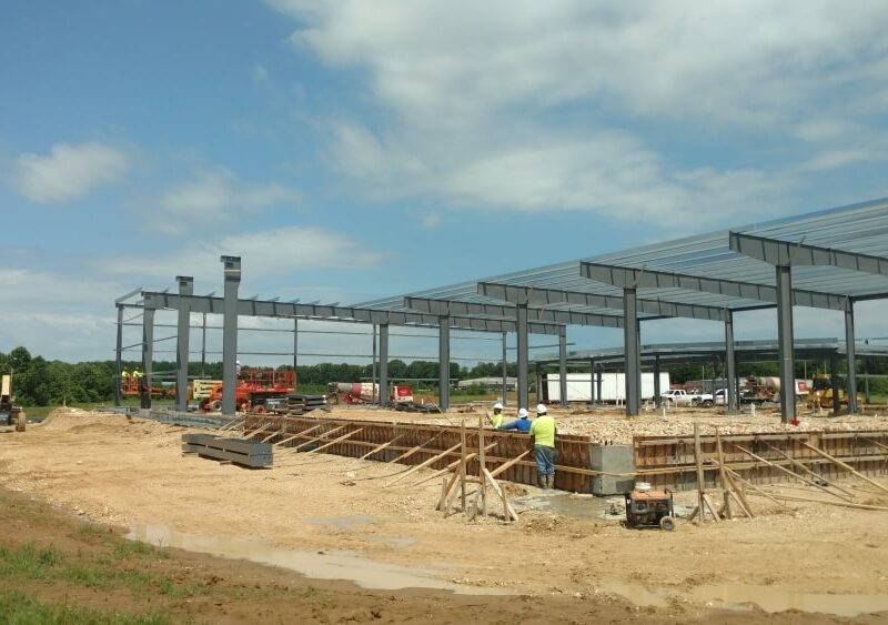 Subcontractors putting up the steel framing for a future food bank.