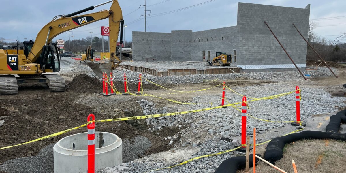 Nashville construction site roped off with orange cones and caution tape.