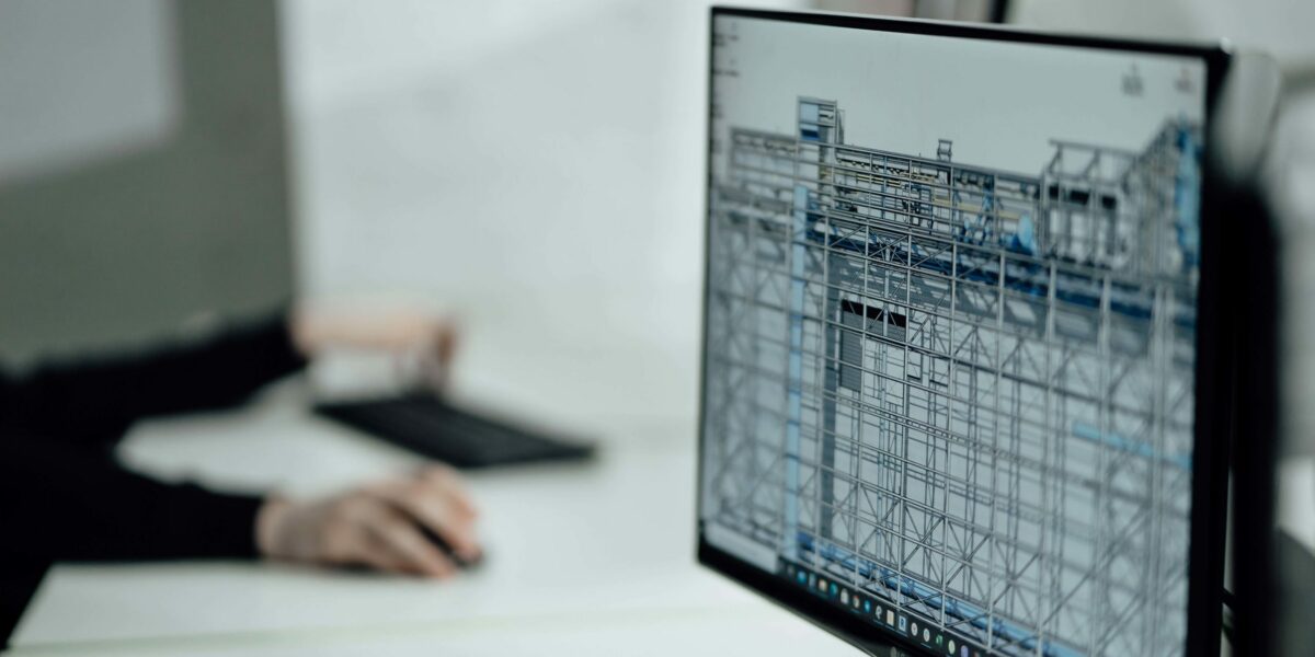 Computer displaying preconstruction software in an office setting