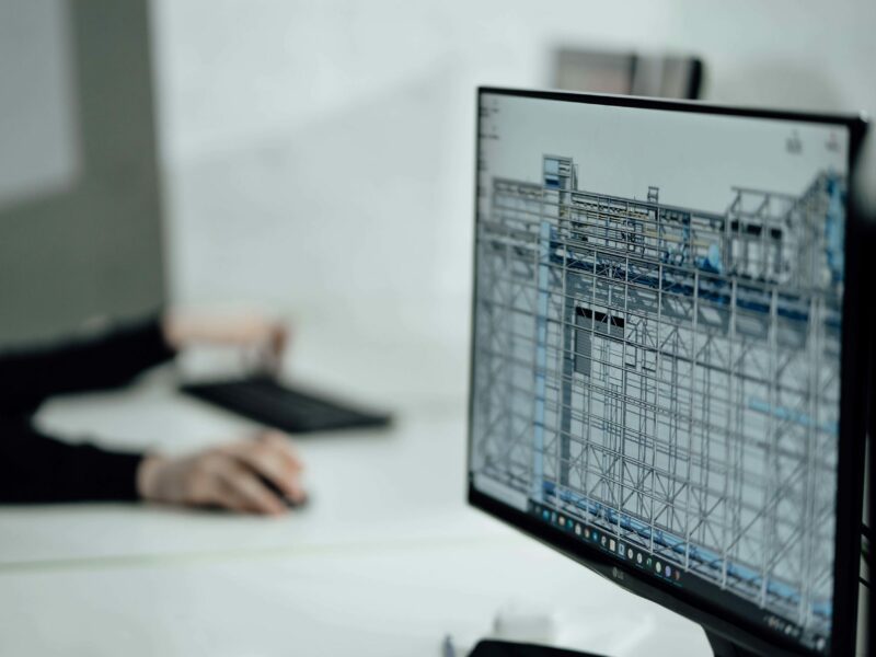 Computer displaying preconstruction software in an office setting